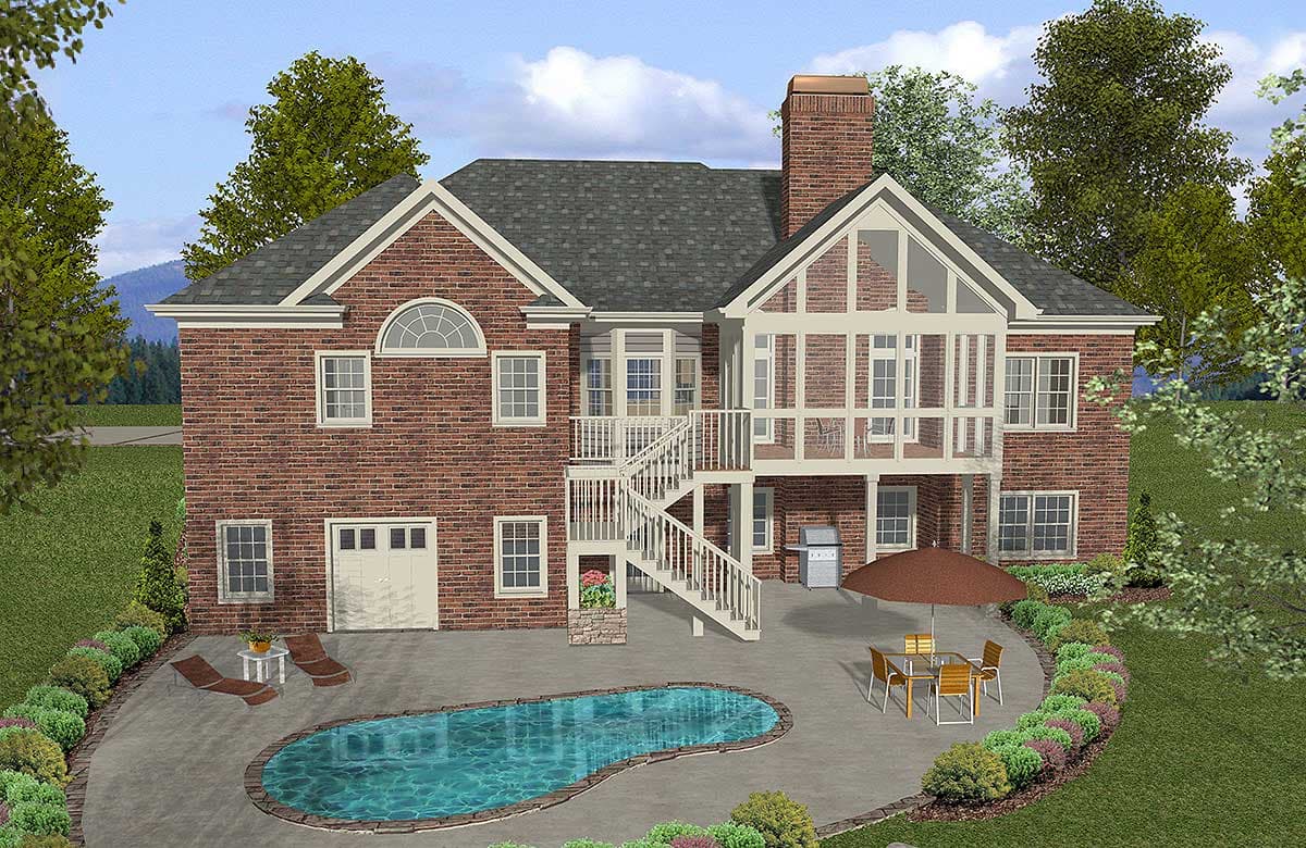 Two-story brick house plan exterior with multi-pane windows, central gabled dormer, attached garage, and rear deck with stairs to patio and pool.