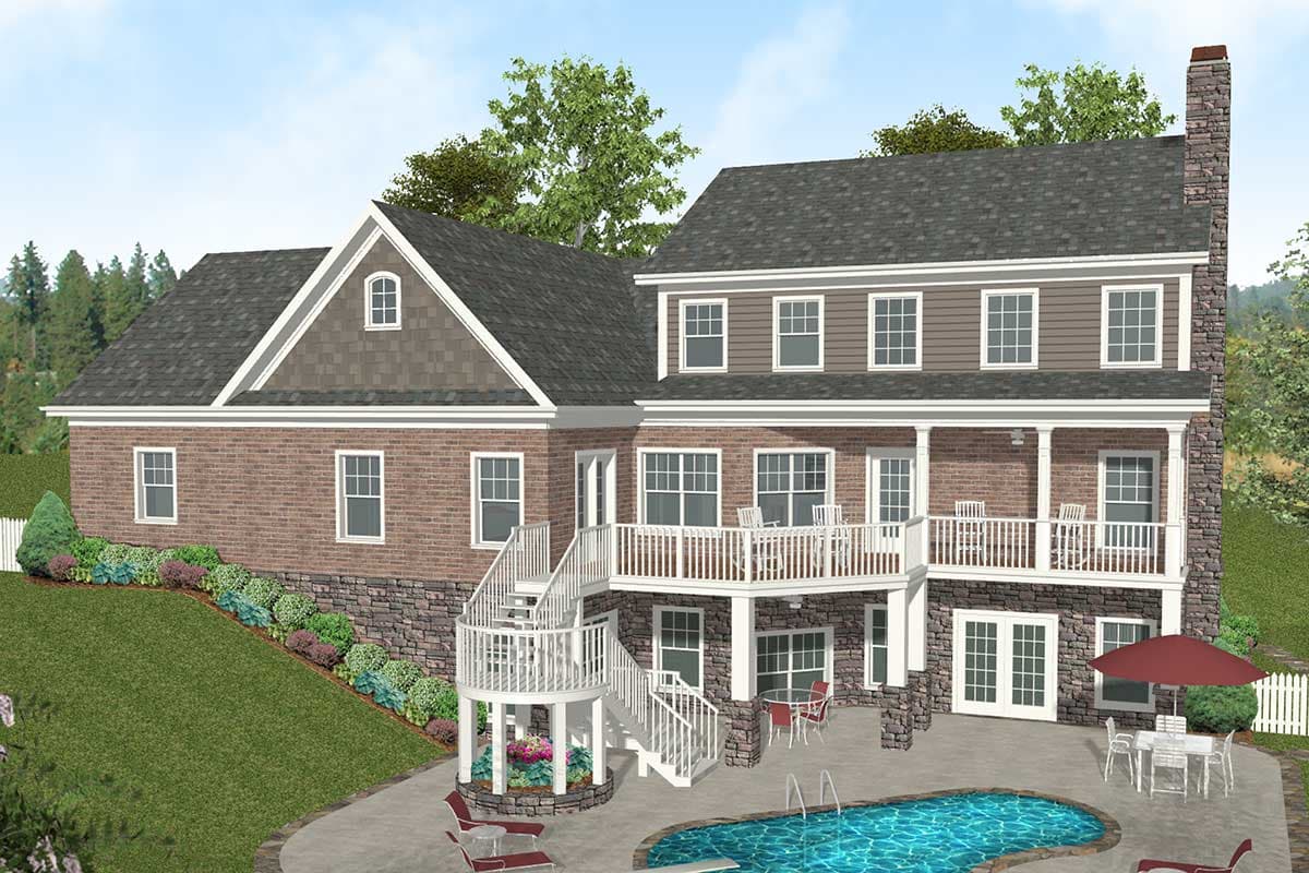 House plan exterior: Three-story brick and siding home with multiple gables, prominent chimney, and wraparound deck.