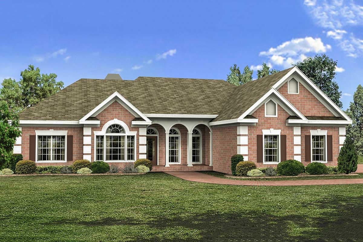 House plan exterior: Ranch-style brick home with arched windows, a covered arched entryway, and multiple gables.