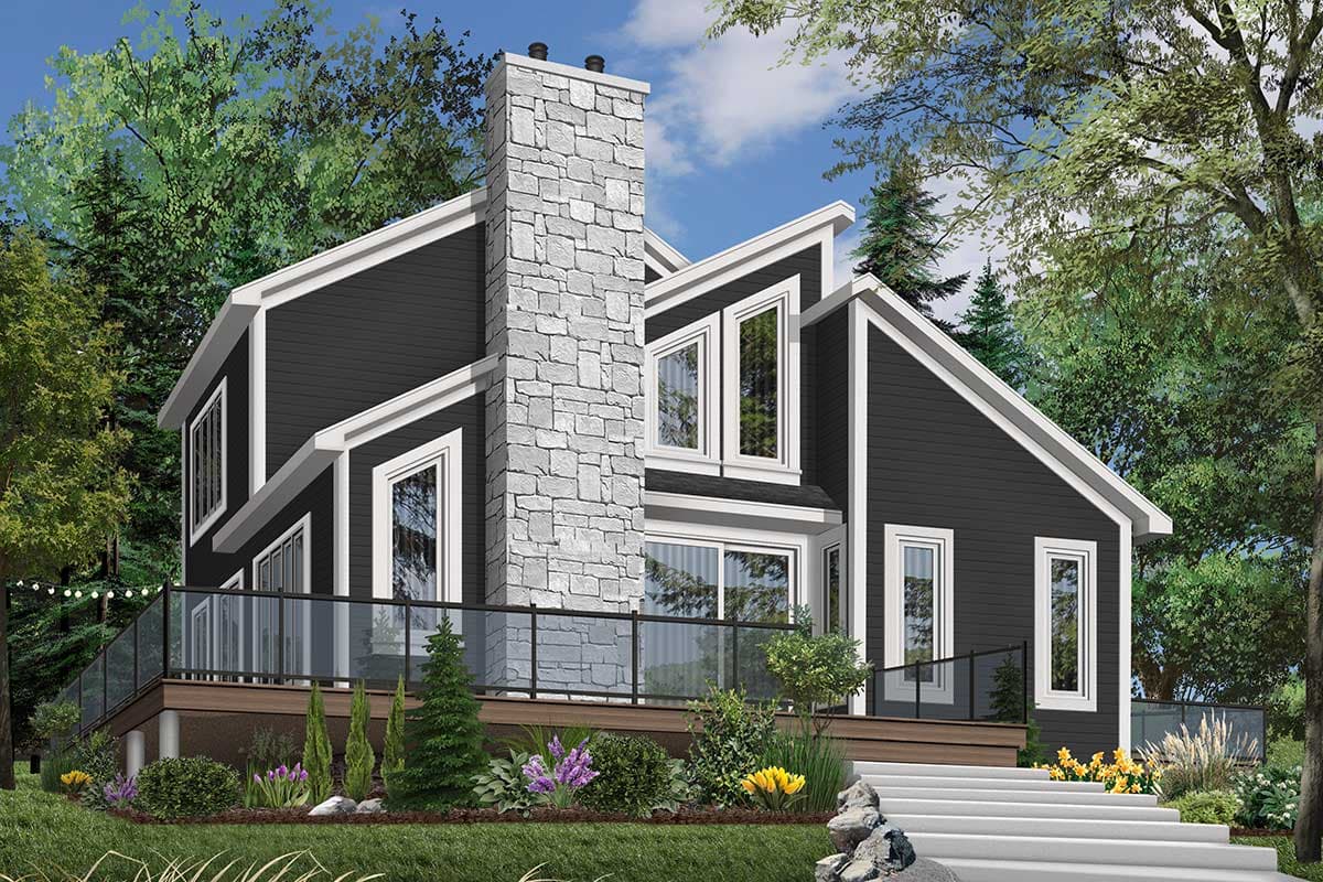 House plan exterior featuring a prominent stone chimney, dark siding, white trim, multiple gables, and a wrap-around deck with glass railings.