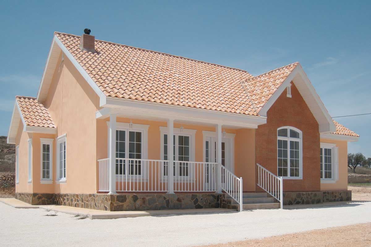 House plan exterior: One-story dwelling with a covered porch, gables, and a tiled roof.