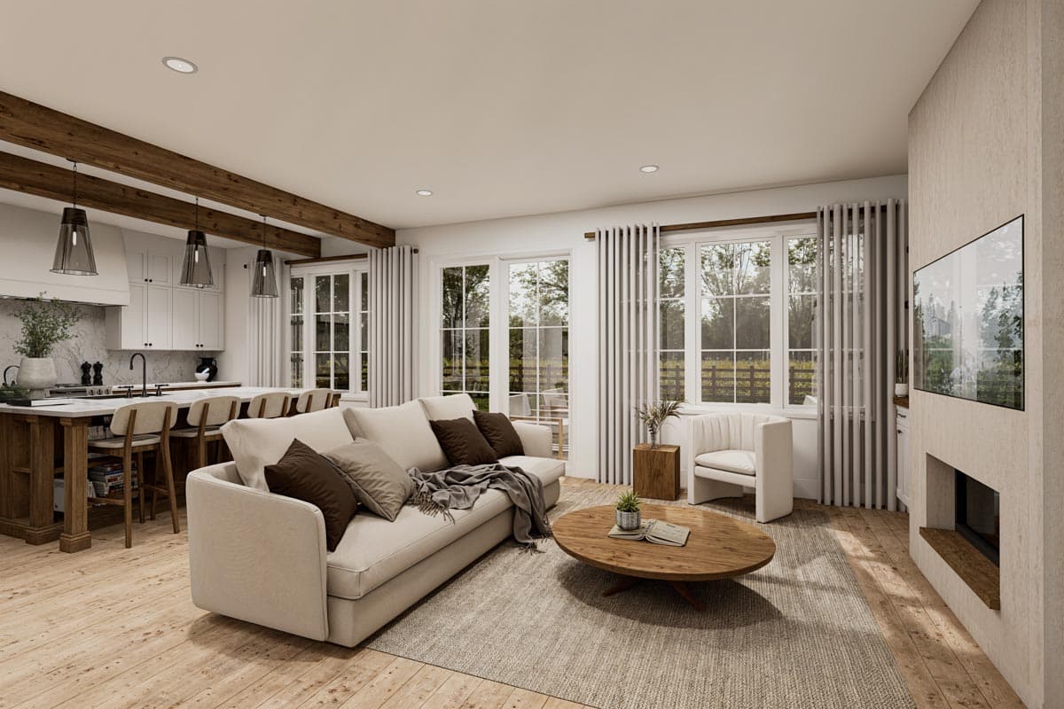 Modern farmhouse living room with sectional sofa, island kitchen, fireplace, and large windows.