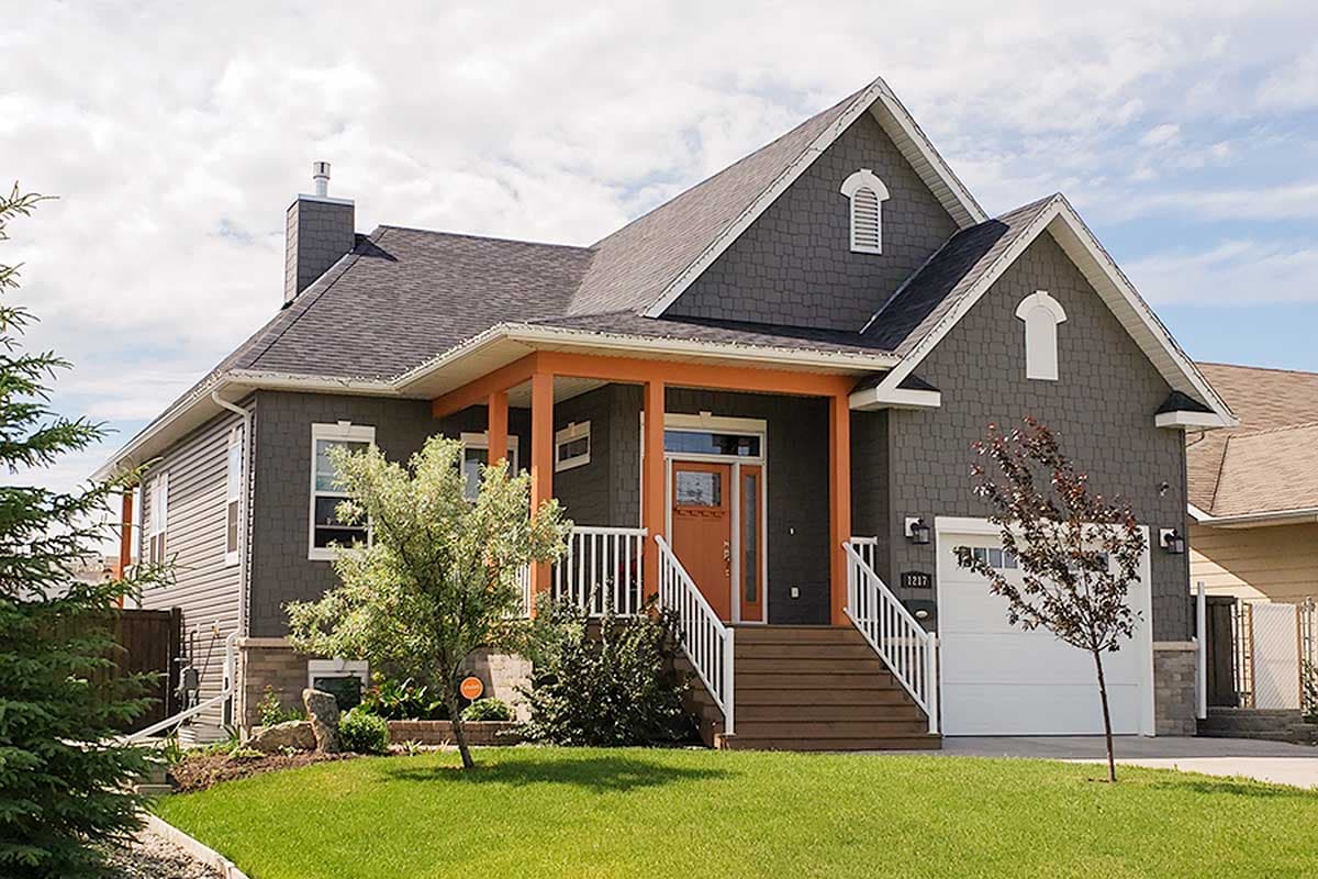 House plan exterior: Two-story Modern Farmhouse with a prominent orange-trimmed porch, gables, and a side-facing garage.