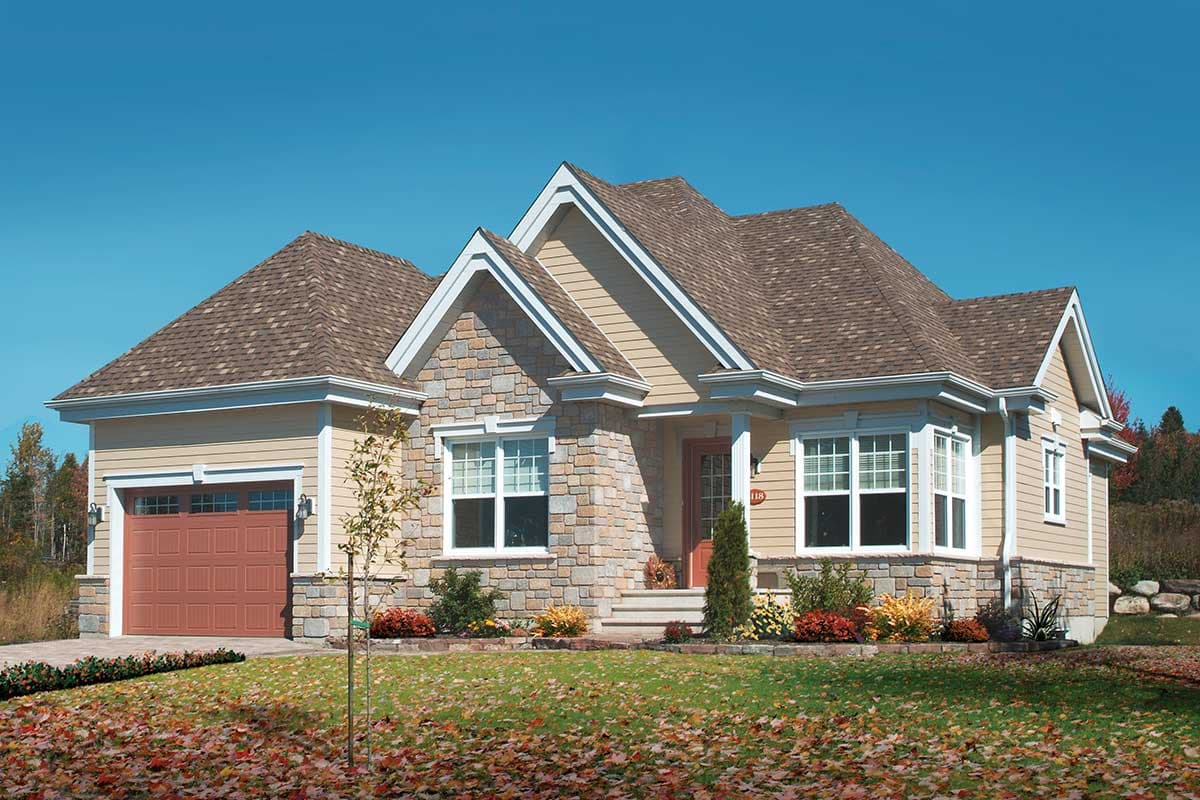 House plan exterior: one-story home with stone and siding, prominent gables, and attached garage.