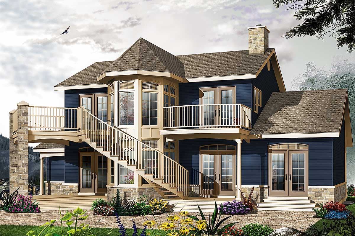 House plan exterior: Two-story home with stone accents, wraparound stairs, upper balcony, bay window, and multiple French doors.