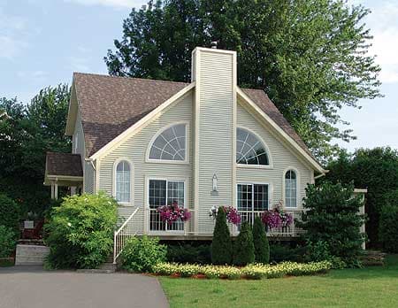 House plan exterior: Two-story home with a prominent central chimney, two arched windows, and a gable roof.