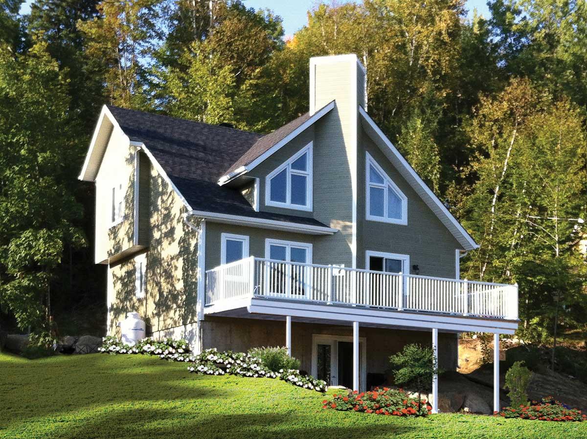 House plan exterior: two-story home with a wrap-around deck, prominent gable end with triangular windows, and a large chimney.
