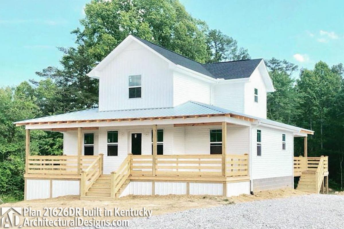 House plan exterior: Two-story Modern Farmhouse with wraparound porch, gables, and metal roof.