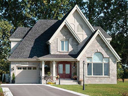 Two-story house plan exterior with stone facade, prominent gables, covered entry with columns, and attached garage.