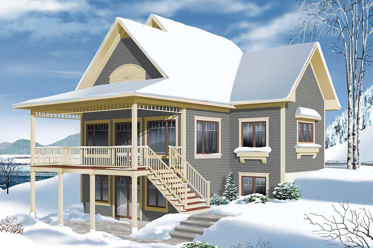 House plan exterior: Two-story home with wraparound porch, prominent gables, and dormer. Snow covers the roof and grounds.