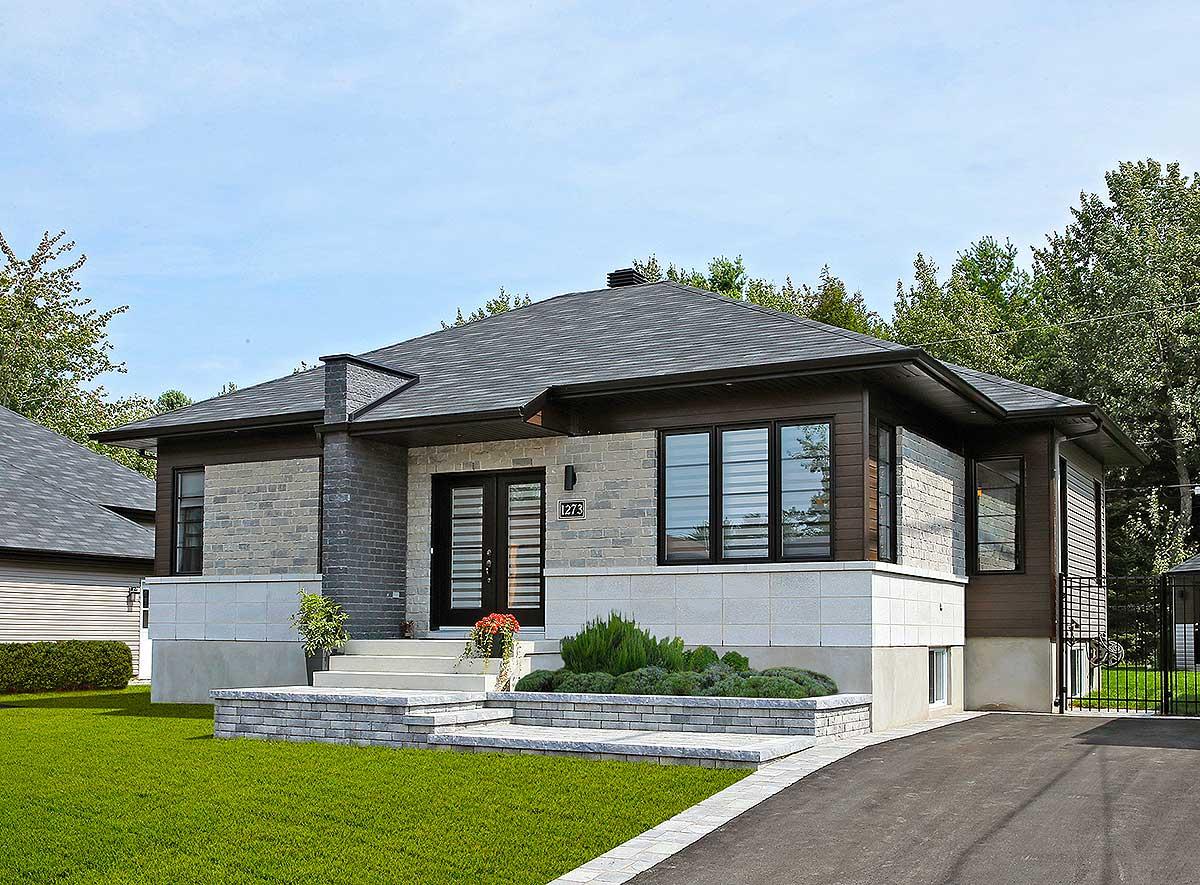 House plan exterior featuring a modern ranch style, large windows, mixed stone and wood siding, and a prominent chimney.