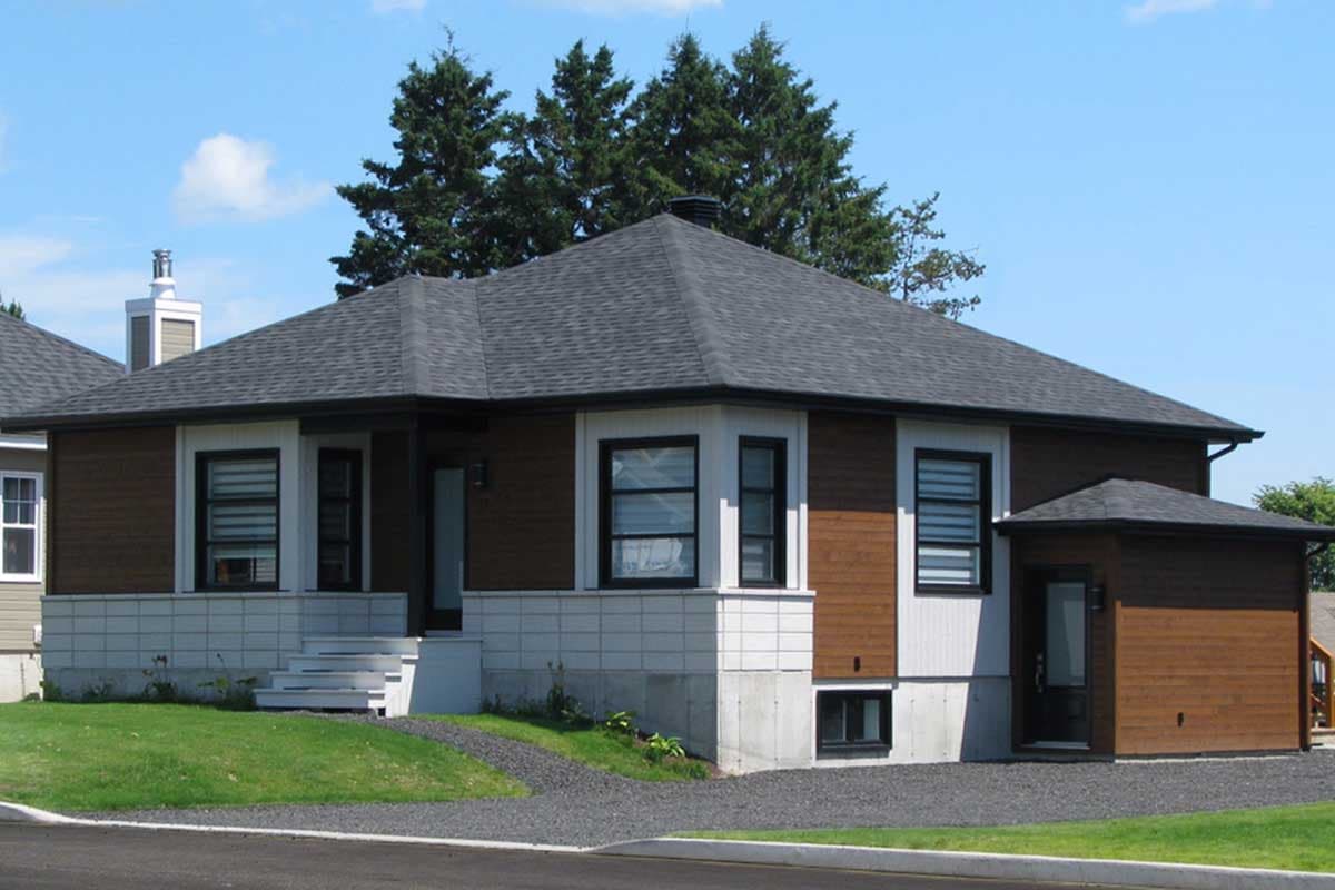 House plan exterior: One-story Modern style home with dark siding, white trim, prominent bay window, and attached single-car garage.
