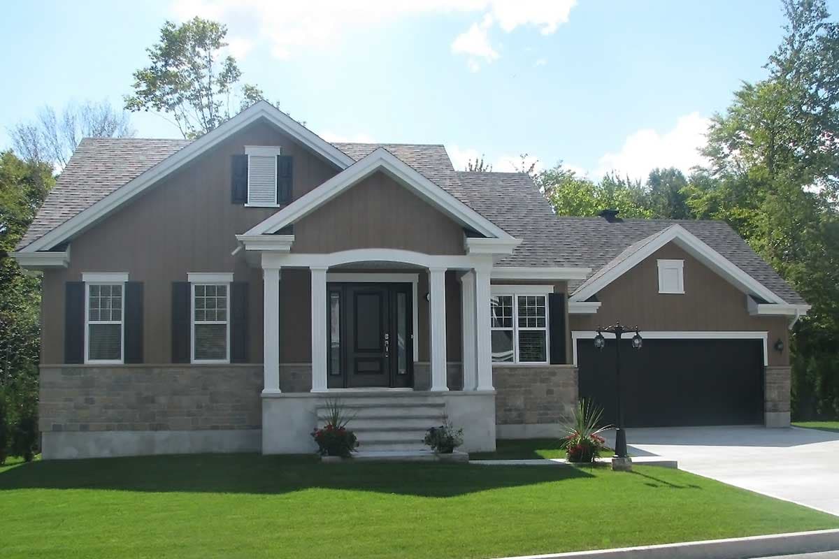 House plan exterior with stone base, central gable, arched portico with columns, and attached garage.