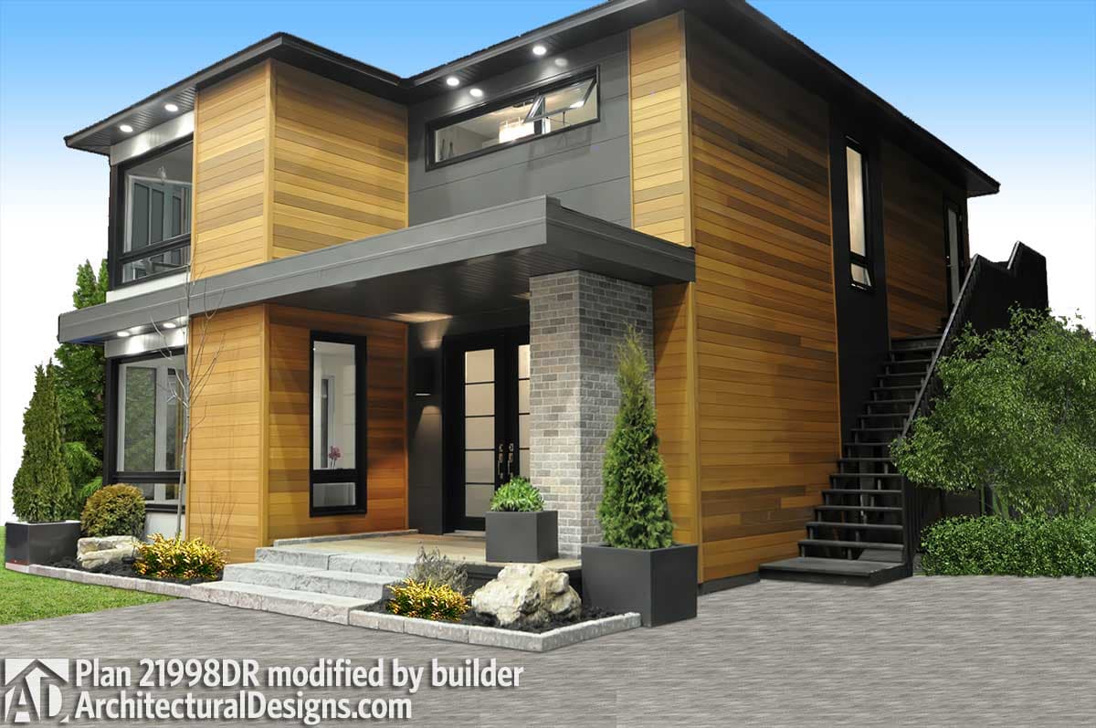 Modern house plan exterior with horizontal wood siding, brick pillar, covered entry, and exterior staircase.