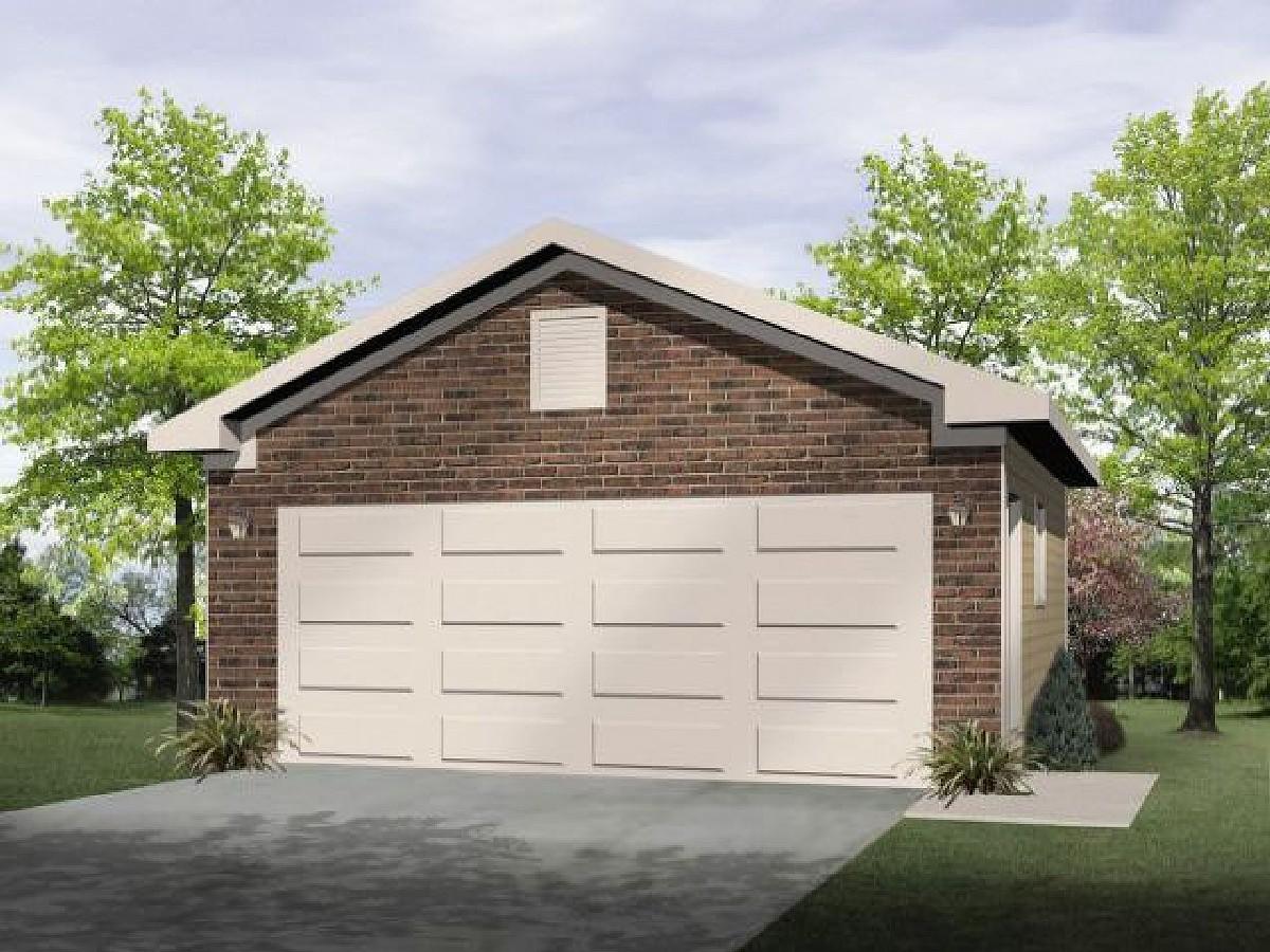 Two-car garage exterior with brick front, horizontal panel doors, gable roof, and soffit vent.