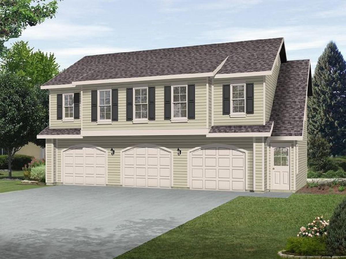 House plan exterior with three-car garage, two stories, and arch-top garage doors.
