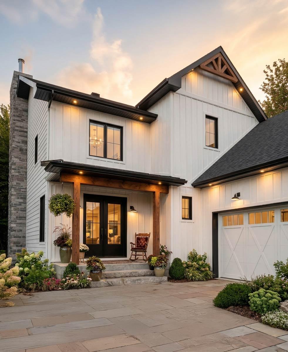 House plan exterior: two-story home with a covered front porch, stone base, gable accents, and a side-entry garage.