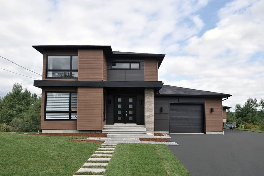 Modern two-story house plan exterior with wood siding, large windows, double front doors, and attached garage.