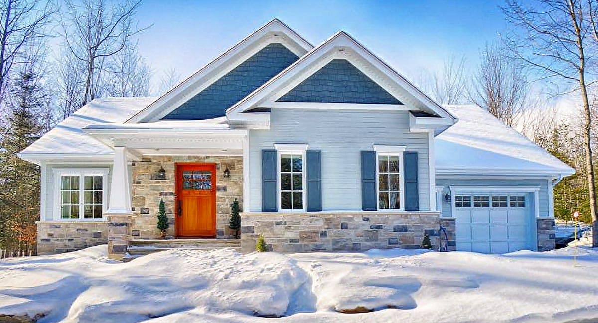 House plan exterior: Modern Farmhouse style, one story, stone base, gabled dormers, covered porch, and attached garage.