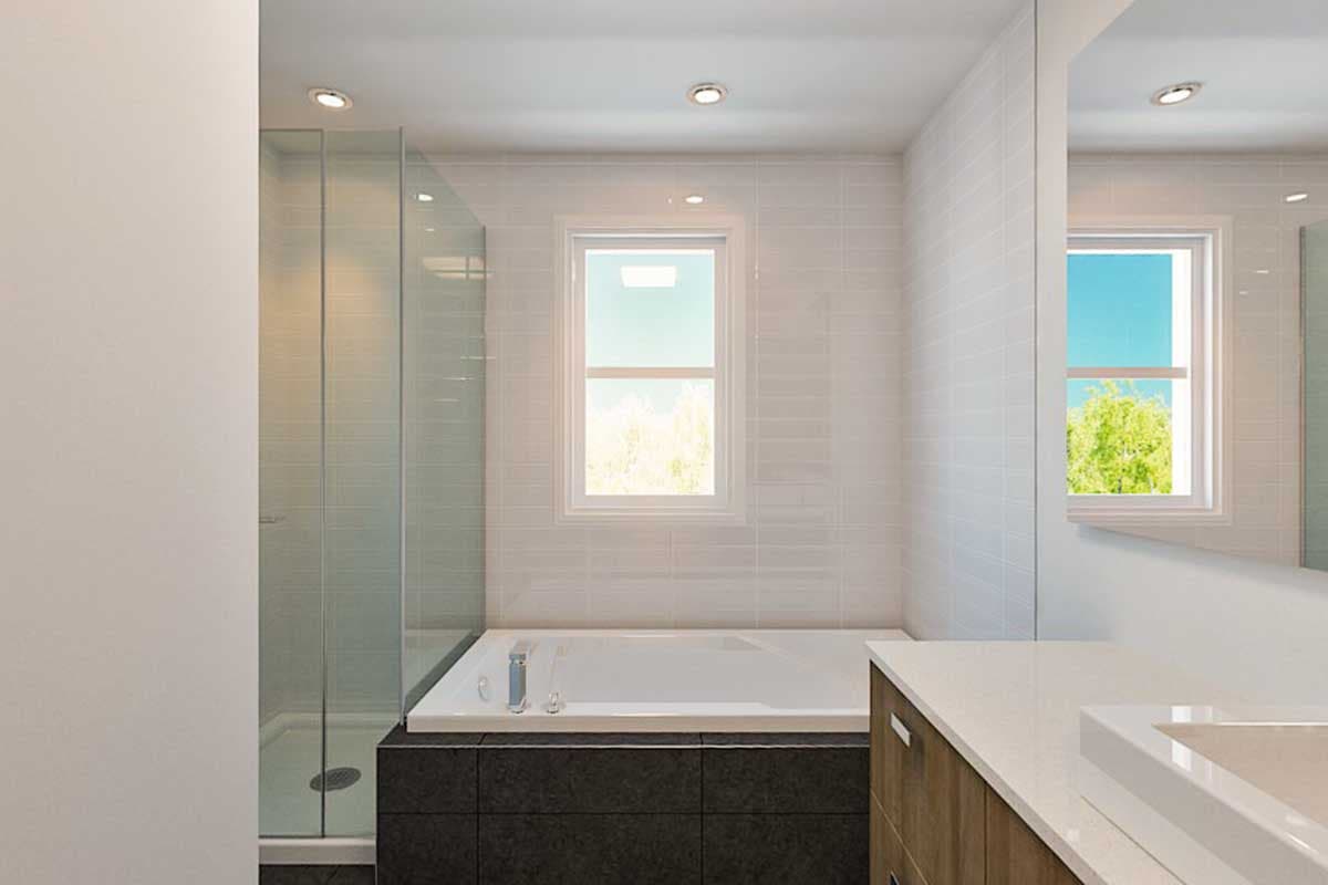 Modern bathroom with glass-enclosed shower, soaking tub, and vanity with wood cabinetry.