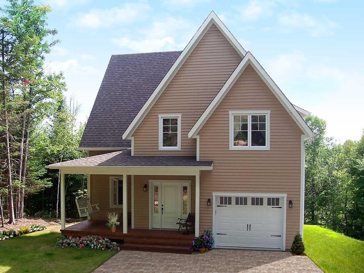 House plan exterior with two stories, a front porch with swing, a gable roof, and a two-car garage.