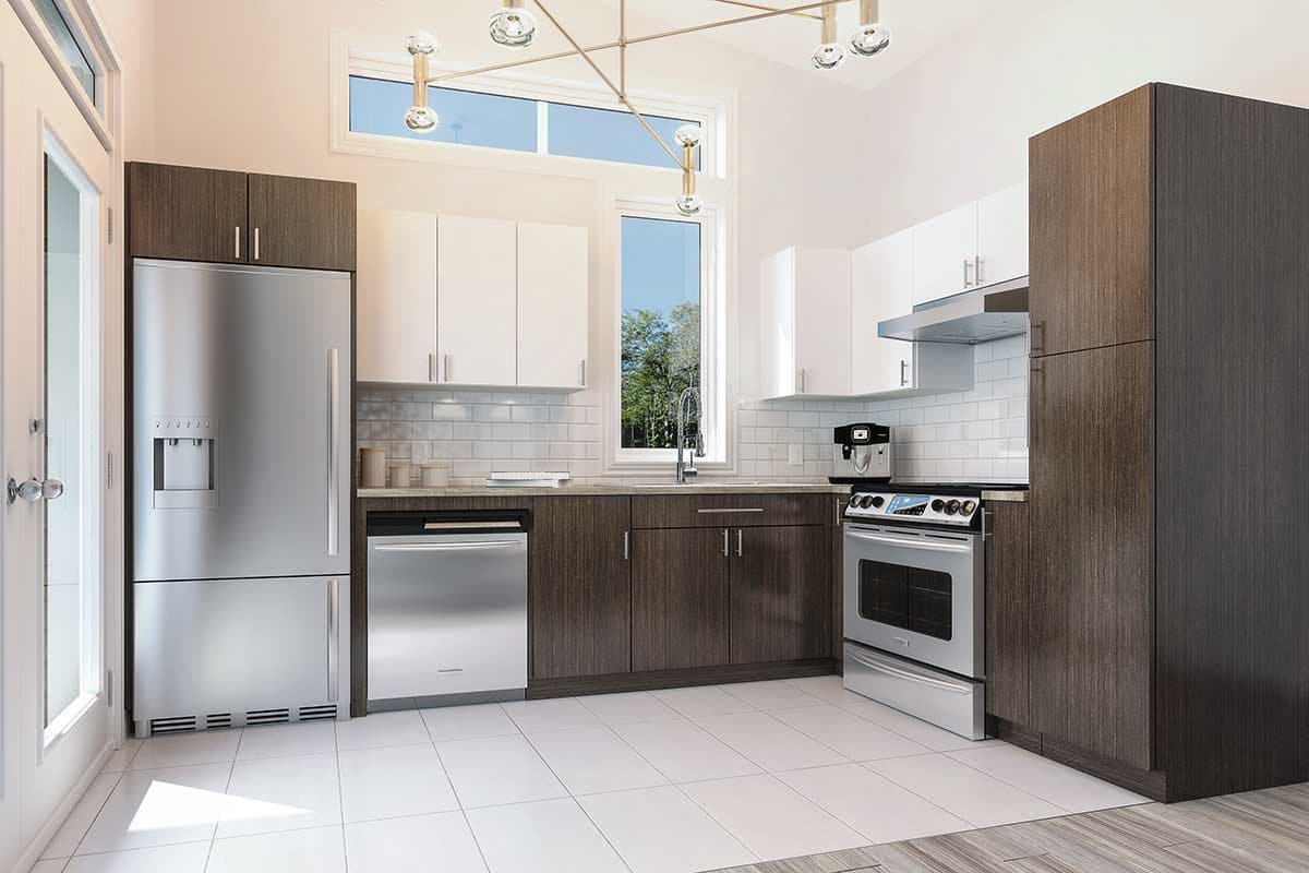 Modern kitchen with stainless steel appliances, dark wood cabinets, white upper cabinets, and a large window overlooking a tree-filled scene.