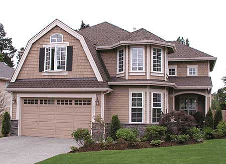 House plan exterior with gambrel dormer, bay windows, arched entryway, and attached garage.