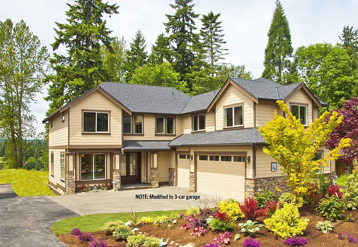 House plan exterior: two-story home with tan siding, dark trim, gables, and a three-car garage.