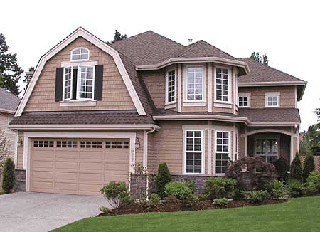 House plan exterior: Two-story home with gambrel dormer, bay windows, arched entry, and attached garage.