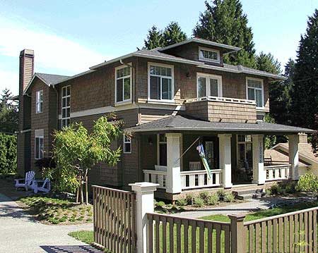 Craftsman house plan exterior with a covered front porch, dormer, multiple gables, and horizontal siding.