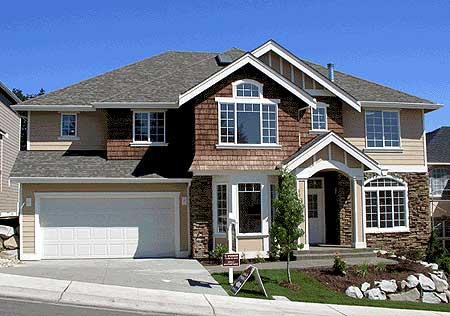 House plan exterior of a two-story home with a two-car garage, arched entry, stacked stone, and cedar shingle accents.