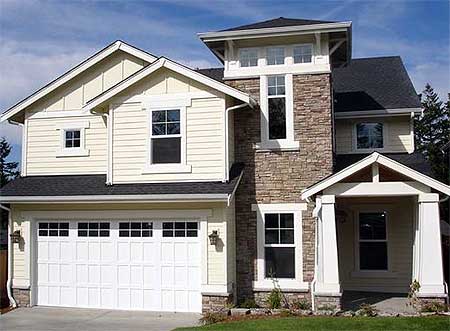 House plan exterior: Two-story home with a prominent stone-clad tower, gabled dormers, and a covered entry porch.