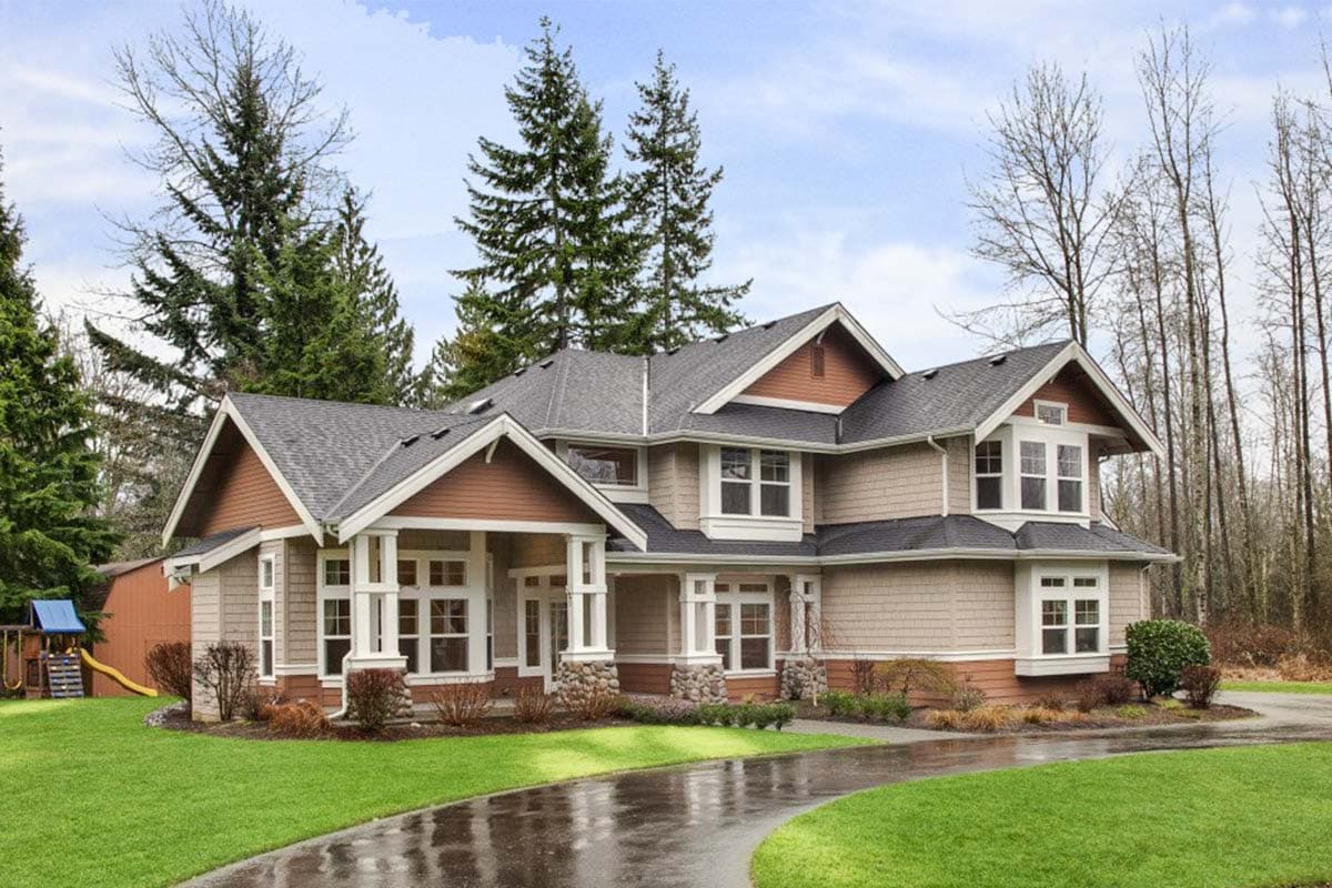 House plan exterior with Craftsman style, two stories, front porch with columns, multiple gables, and shake siding.