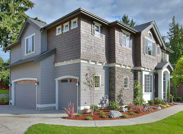 House plan exterior: two-story home with dual garages, contrasting siding, stone accents, and varied rooflines.