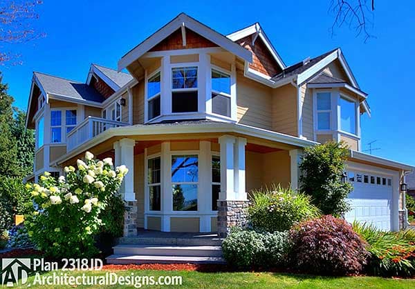House plan exterior, two stories, covered porch with stone accents, gables with wood trim, bay windows, and attached garage.