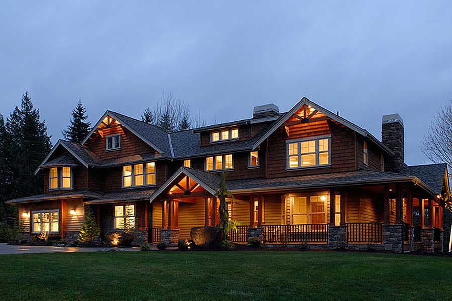Craftsman style house plan exterior with prominent gables, stone accents, and a covered wrap-around porch.