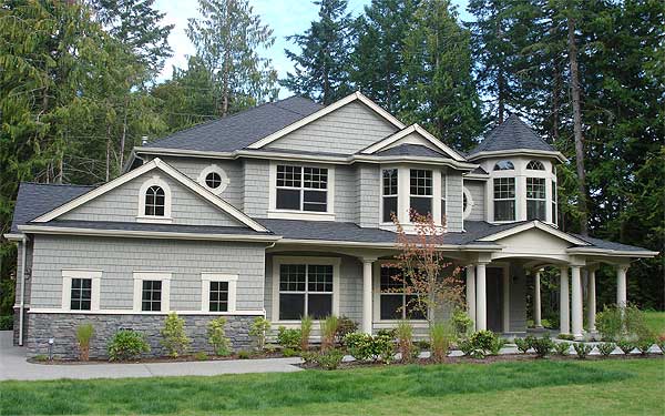 House plan exterior: Two-story home with gabled dormers, stone foundation, arched window, and covered porch with columns.