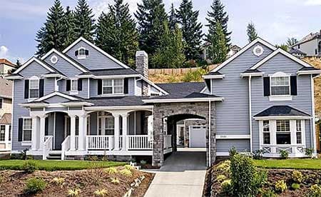 House plan exterior: Two-story home with covered porch, stone archway, multiple gables, and dormer.