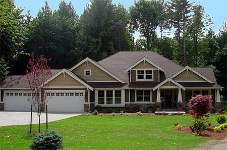 Craftsman style house plan exterior with a gabled roof, dormers, covered entry porch, and a three-car garage.