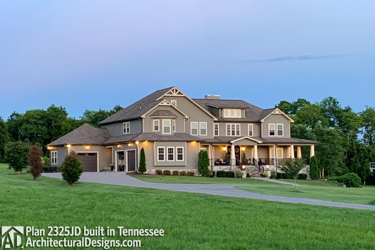 Craftsman style house plan exterior with two stories, gables, dormers, covered front porch, and side-entry garage.