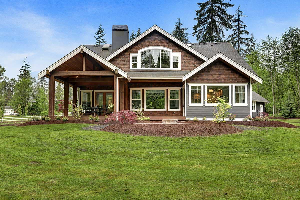 Craftsman style house plan exterior with covered porch, dormer window, and multiple gables.
