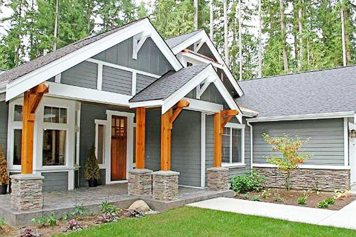 House plan exterior: Craftsman style, one story, covered entry with timber supports, stone base, and gabled rooflines.