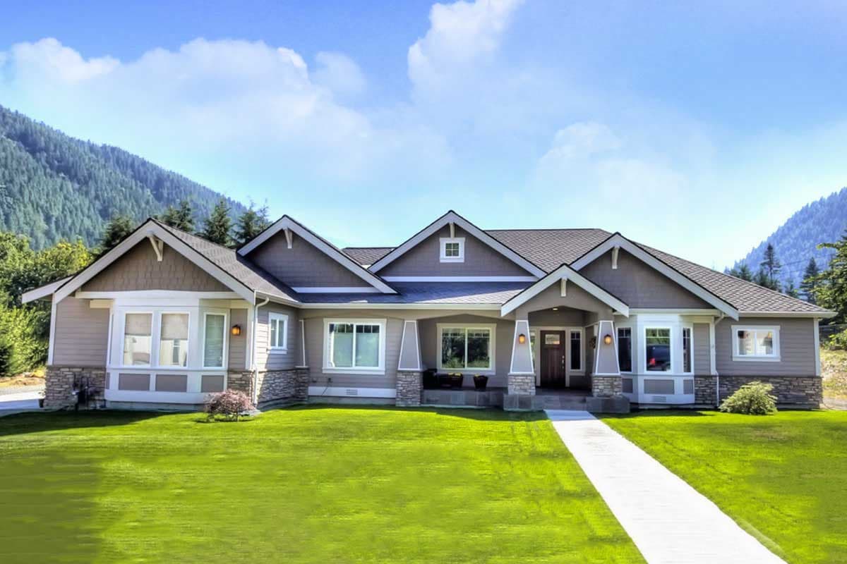 Craftsman style ranch house plan exterior with stone accents, covered entry with columns, multiple gables, and dormer.