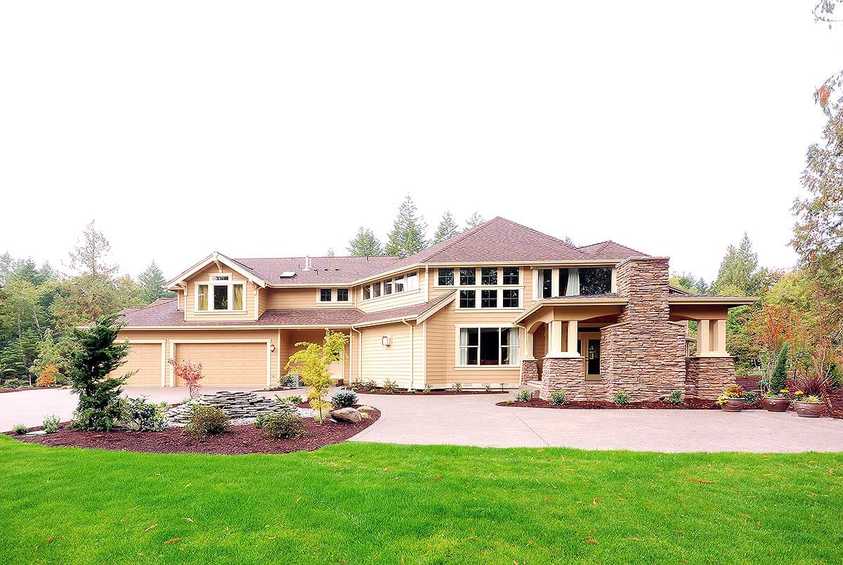 House plan exterior of a two-story home with a three-car garage, prominent stone chimney, and multiple gables.