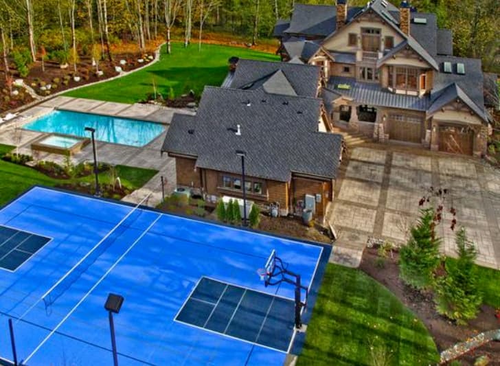 House plan exterior of a multi-story residence with a pool, spa, and multi-sport court.
