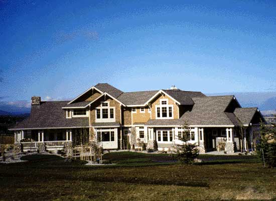 Craftsman style house plan exterior, two stories, wraparound porch with stone columns, and multiple gables.