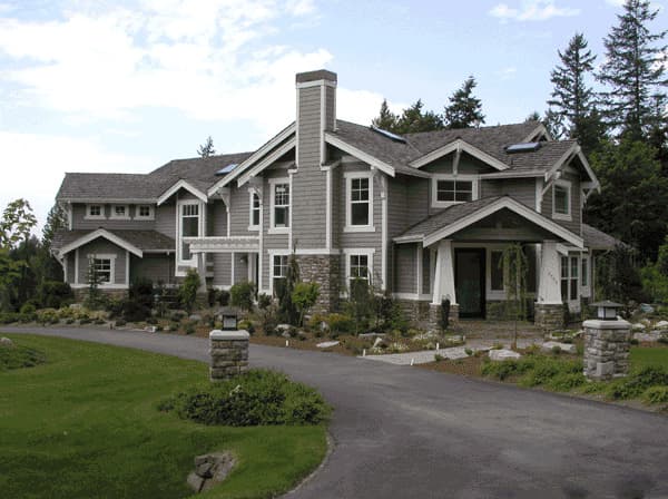 Craftsman style house plan exterior with gabled dormers, a stone chimney, and a covered front porch with stone columns.