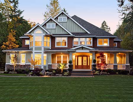 House plan exterior: two-story home with prominent gables, a wide covered porch, and a bay window.