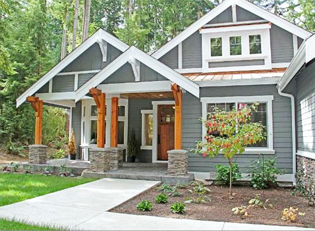 Craftsman house plan exterior with stone-clad posts, timber supports, and prominent gables.