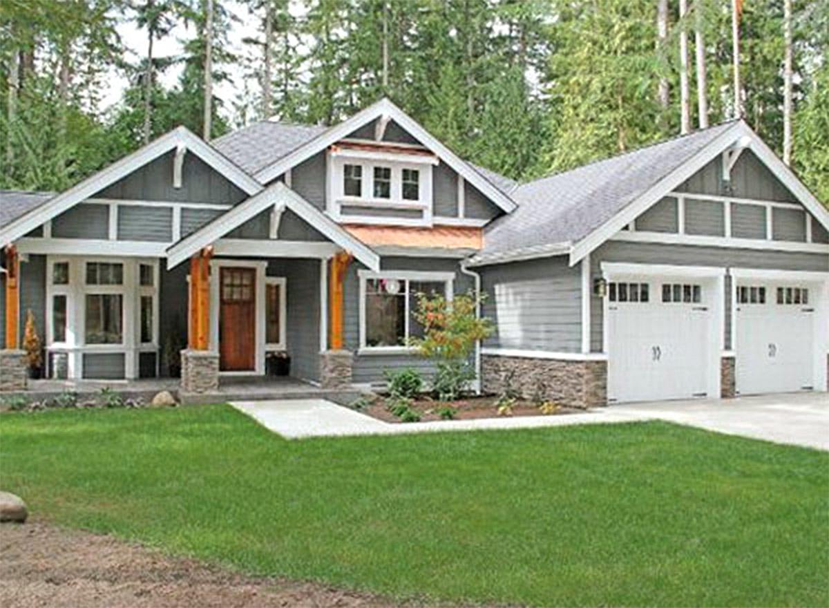 Craftsman style house plan exterior with covered entry porch, gable dormer, stone accents, and a three-car garage.
